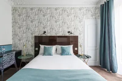 Un ou plusieurs lits dans un hébergement de l'établissement Lennon by Avalon Hotel Paris Gare du Nord
