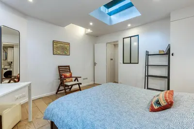 Un ou plusieurs lits dans un hébergement de l'établissement Les Vignes de Montmartre