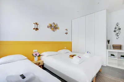 Un ou plusieurs lits dans un hébergement de l'établissement Charming apart -1BR-5P - République