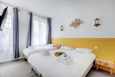 Un ou plusieurs lits dans un hébergement de l'établissement Charming apart -1BR-5P - République