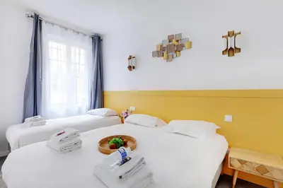 Un ou plusieurs lits dans un hébergement de l'établissement Charming apart -1BR-5P - République