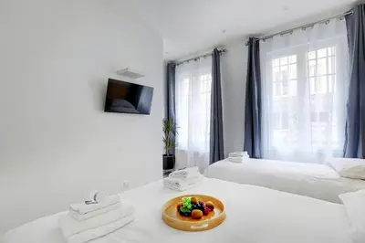 Un ou plusieurs lits dans un hébergement de l'établissement Charming apart -1BR-5P - République