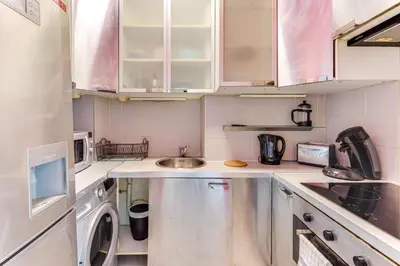 Cuisine ou kitchenette dans l'établissement L'emplacement Idéal - Tour Eiffel 10min - NETFLIX -