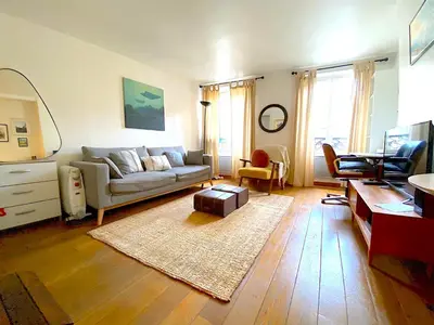 Coin salon dans l'établissement L'appartement Jour