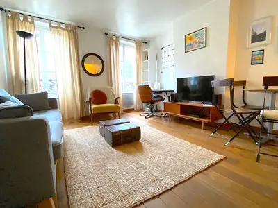 Télévision ou salle de divertissement dans l'établissement L'appartement Jour
