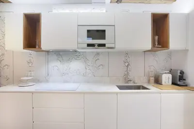 Cuisine ou kitchenette dans l'établissement Apartment Le Marais by Studio prestige