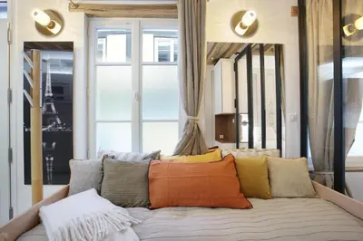 Un ou plusieurs lits dans un hébergement de l'établissement Apartment Le Marais by Studio prestige
