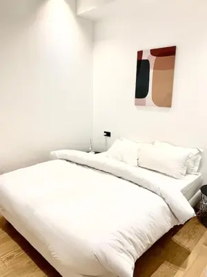 Un ou plusieurs lits dans un hébergement de l'établissement Luxe Parisien - Petit Varenne