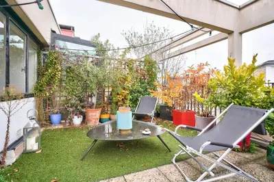 Jardin de l'établissement GuestReady - Apt confortable avec terrasse au 18e