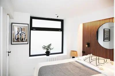 Un ou plusieurs lits dans un hébergement de l'établissement Appartement de caractère aux portes du Marais - 4P - FLAT-GUEST