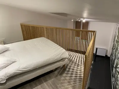 Un ou plusieurs lits dans un hébergement de l'établissement Studio Porte de Gentilly