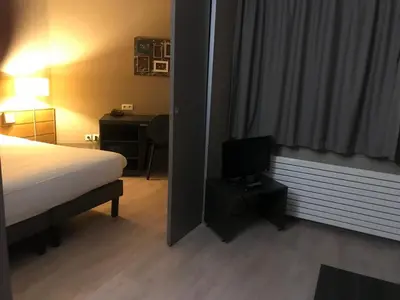 Un ou plusieurs lits dans un hébergement de l'établissement Aparthotel XV Porte Versailles 2P 4 Pers Parking