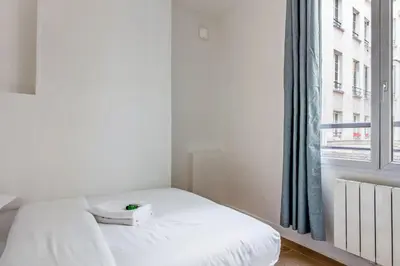 Un ou plusieurs lits dans un hébergement de l'établissement Appartement des Bergères - Welkeys