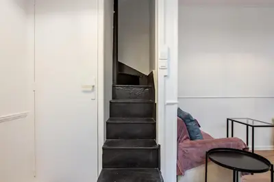 Coin salon dans l'établissement Appartement des Bergères - Welkeys