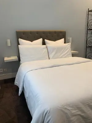 Un ou plusieurs lits dans un hébergement de l'établissement Charming Eiffel Tower Appartement