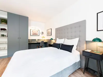 Un ou plusieurs lits dans un hébergement de l'établissement LivinParis - Luxury 2 Bedrooms Centre Pompidou
