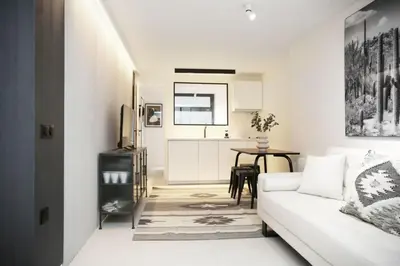 Coin salon dans l'établissement Logement Idéal en Famille - Porte du Marais - 6P - FLAT-GUEST