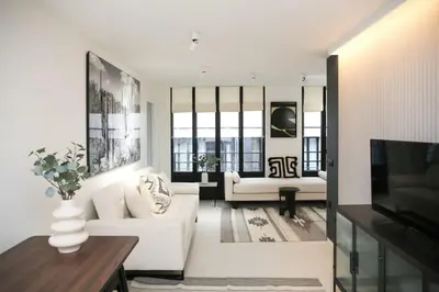 Coin salon dans l'établissement Logement Idéal en Famille - Porte du Marais - 6P - FLAT-GUEST