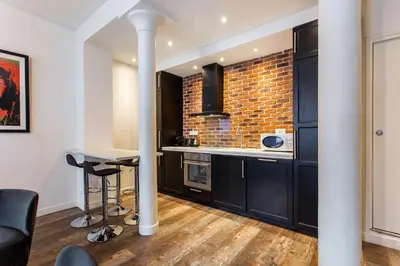 Cuisine ou kitchenette dans l'établissement MBM - Paradis