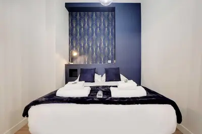 Un ou plusieurs lits dans un hébergement de l'établissement Modern Apartment 1BR- 4P Le Marais Quarter