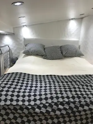 Un ou plusieurs lits dans un hébergement de l'établissement Superbe Triplex au Coeur de Montorgueil