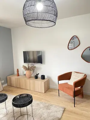Télévision ou salle de divertissement dans l'établissement Cosy appart proche PARIS