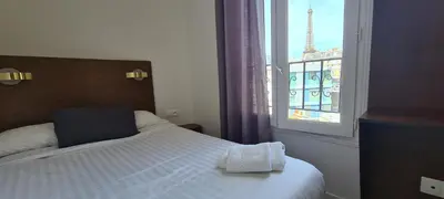 Un ou plusieurs lits dans un hébergement de l'établissement Dupleix Hotel