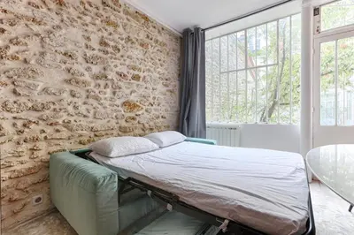Un ou plusieurs lits dans un hébergement de l'établissement MyKeypers - Splendid Parisian Flat 6P - 2 Bedrooms - Rue Montorgueil