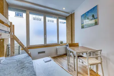 Un ou plusieurs lits dans un hébergement de l'établissement Les Vignes de Montmartre - Studio