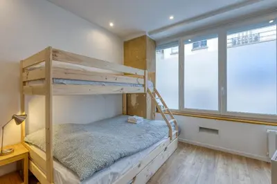 Un ou plusieurs lits dans un hébergement de l'établissement Les Vignes de Montmartre - Studio