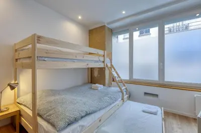 Un ou plusieurs lits dans un hébergement de l'établissement Les Vignes de Montmartre - Studio