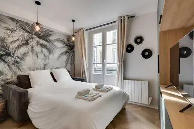 Un ou plusieurs lits dans un hébergement de l'établissement 228 Suite Romy - Superbe Appartement à Paris