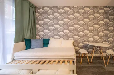 Un ou plusieurs lits dans un hébergement de l'établissement New Studio Near Bois de Vincennes