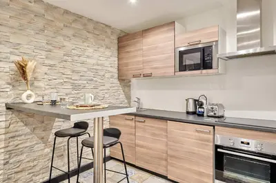Cuisine ou kitchenette dans l'établissement Studio Le Marais by Studio prestige