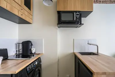 Cuisine ou kitchenette dans l'établissement Cosy and peaceful studio - 2P - Paris Center