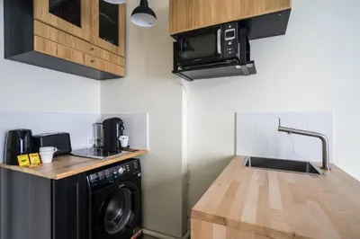 Cuisine ou kitchenette dans l'établissement Cosy and peaceful studio - 2P - Paris Center