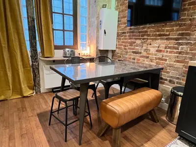 Coin salon dans l'établissement GOOD VIBES Luxurious Loft in Paris 11th, with AC & table football