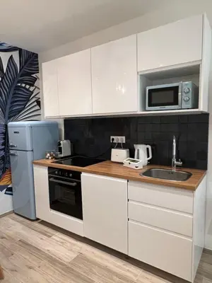 Cuisine ou kitchenette dans l'établissement THE PALM central Paris - Comfort and air conditioning in the 9th
