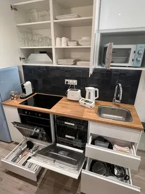 Cuisine ou kitchenette dans l'établissement THE PALM central Paris - Comfort and air conditioning in the 9th