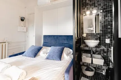 Un ou plusieurs lits dans un hébergement de l'établissement GuestReady - Fantastic studio near Sacré-Cœur