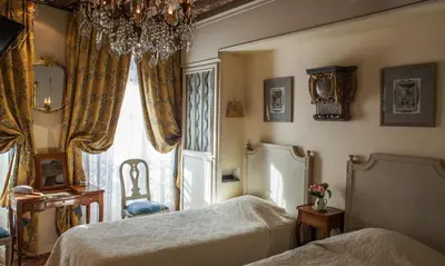 Un ou plusieurs lits dans un hébergement de l'établissement Hotel Caron de Beaumarchais