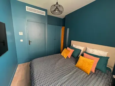Un ou plusieurs lits dans un hébergement de l'établissement Relais Cocorico 2 Bedrooms with AC, 2 bathrooms, 8 min Eiffel Tower