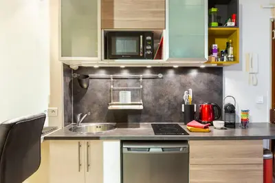 Cuisine ou kitchenette dans l'établissement Studio Montonnerre avec terrasse proche Necker et Montparnasse