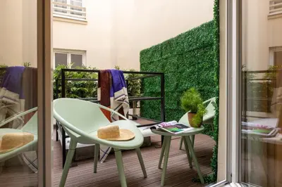 Coin salon dans l'établissement Yuna Saint-Honoré - Serviced Apartments