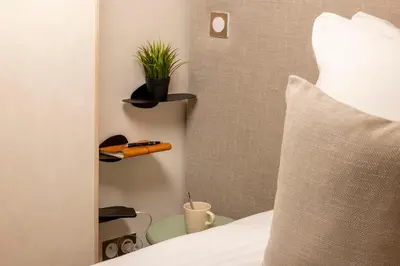 Un ou plusieurs lits dans un hébergement de l'établissement Yuna Saint-Honoré - Serviced Apartments