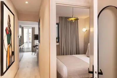 Un ou plusieurs lits dans un hébergement de l'établissement Yuna Saint-Honoré - Serviced Apartments