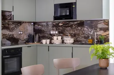 Cuisine ou kitchenette dans l'établissement Yuna Saint-Honoré - Serviced Apartments