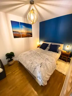 Un ou plusieurs lits dans un hébergement de l'établissement Cozy 2 pièces AUX PORTES DE PARIS !