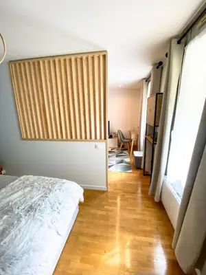 Un ou plusieurs lits dans un hébergement de l'établissement Cozy 2 pièces AUX PORTES DE PARIS !