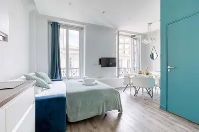 Un ou plusieurs lits dans un hébergement de l'établissement New & Design 1bd Flat in the Heart of le Marais